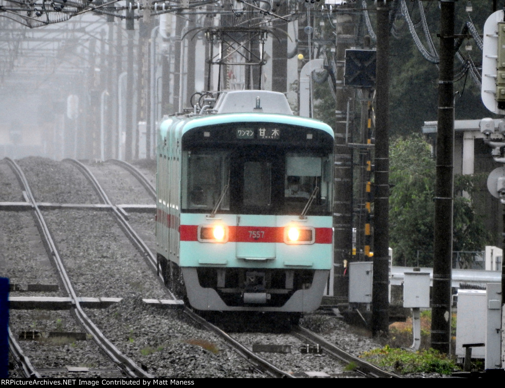 In the light rain down the track